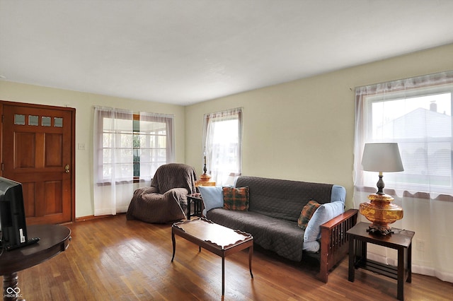 living area featuring wood finished floors and baseboards