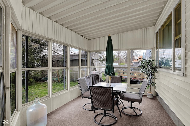 sunroom / solarium with outdoor dining space
