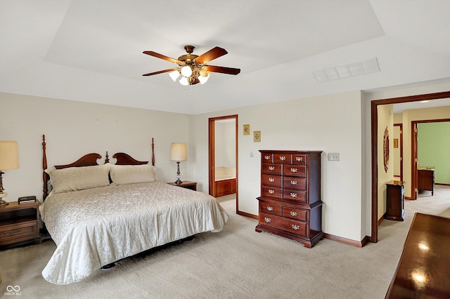 340 Southwind Ln, Greenwood, IN 46142 - bedroom with light colored carpet, connected bathroom, and a ceiling fan