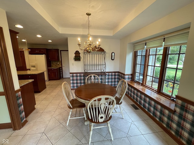 340 Southwind Ln, Greenwood, IN 46142 - dining room with a raised ceiling, a chandelier, light tile patterned flooring, and recessed lighting