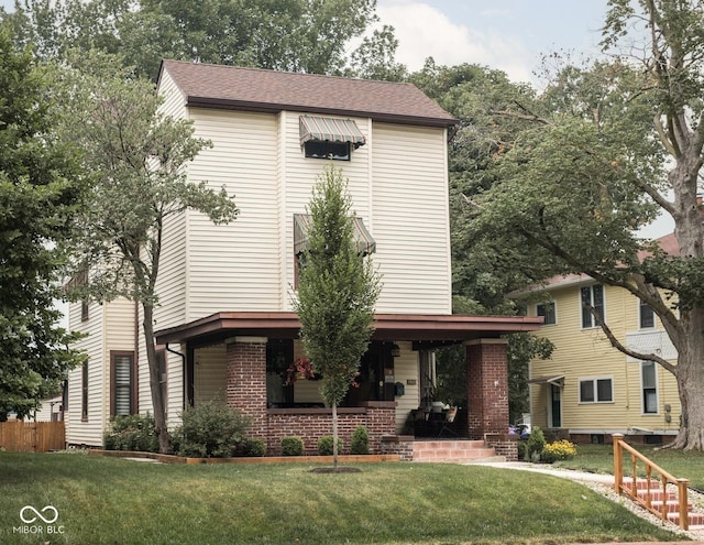 40 N Ritter Ave, Indianapolis, IN 46219 - traditional-style house featuring covered porch and brick siding