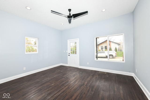 interior space featuring recessed lighting, dark wood-type flooring, baseboards, and ceiling fan
