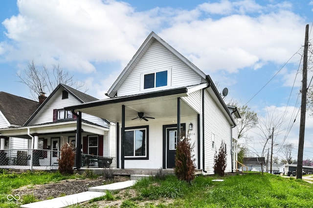 bungalow with a ceiling fan and covered porch