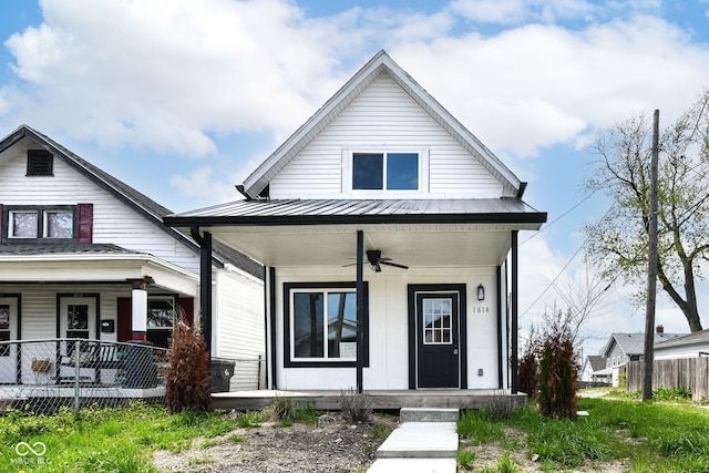 view of front facade featuring metal roof, a ceiling fan, and covered porch