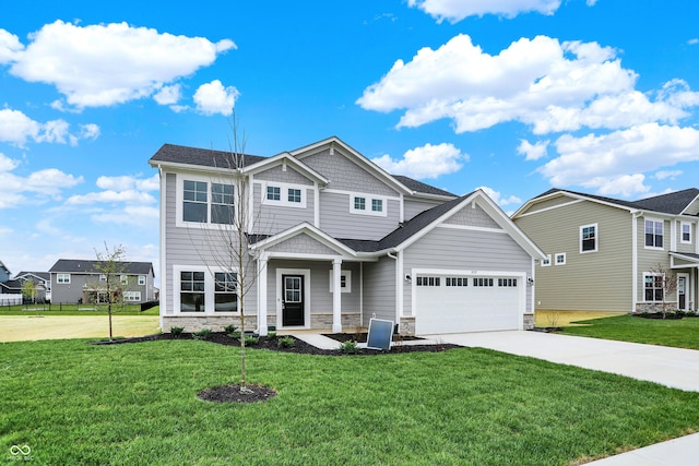 3727 Thomas Jefferson Ct, Westfield, IN 46074 - craftsman-style house featuring concrete driveway, stone siding, a front lawn, and a garage