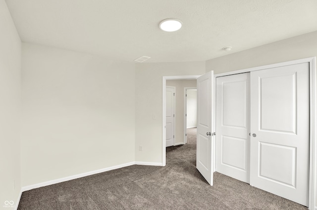 3727 Thomas Jefferson Ct, Westfield, IN 46074 - unfurnished bedroom featuring dark colored carpet, baseboards, and a closet