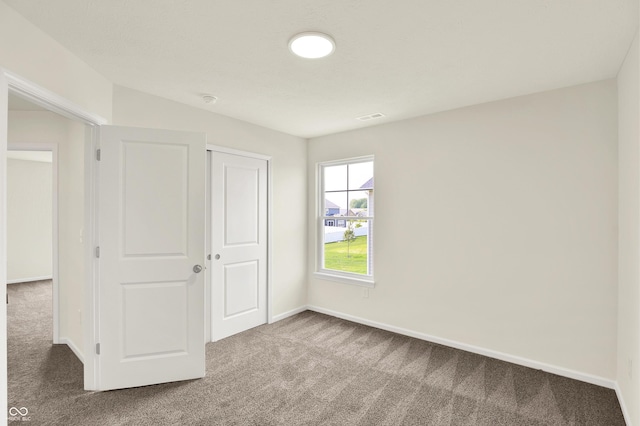 3727 Thomas Jefferson Ct, Westfield, IN 46074 - unfurnished bedroom with carpet, a closet, and baseboards