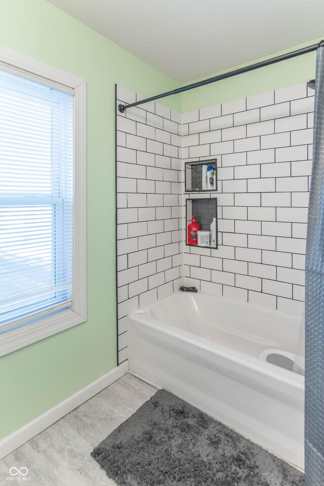 504 S Lebanon St, Lebanon, IN 46052 - full bath with a wealth of natural light, baseboards, and shower / washtub combination