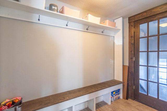 504 S Lebanon St, Lebanon, IN 46052 - mudroom with light wood finished floors and a textured ceiling