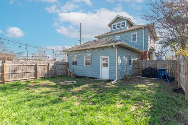 504 S Lebanon St, Lebanon, IN 46052 - back of house with a fenced backyard and a lawn