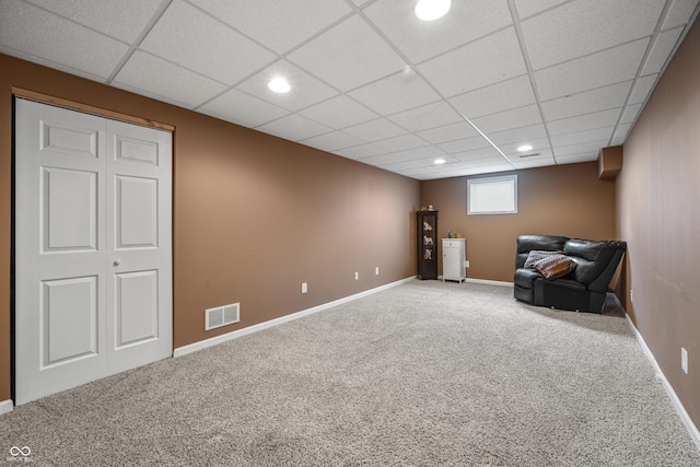 unfurnished room with a paneled ceiling, carpet flooring, visible vents, and recessed lighting