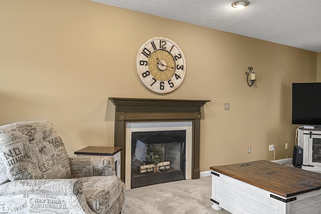 living area with a fireplace, carpet flooring, and baseboards