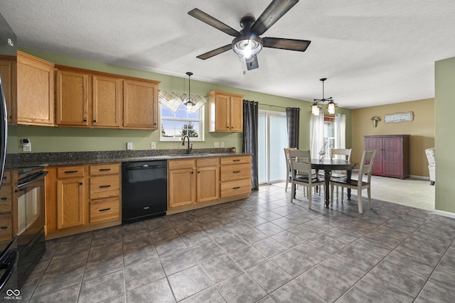 kitchen featuring dishwasher, ceiling fan with notable chandelier, a sink, and hanging light fixtures