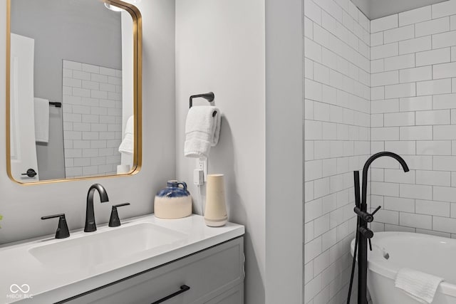 bathroom with a freestanding bath and vanity