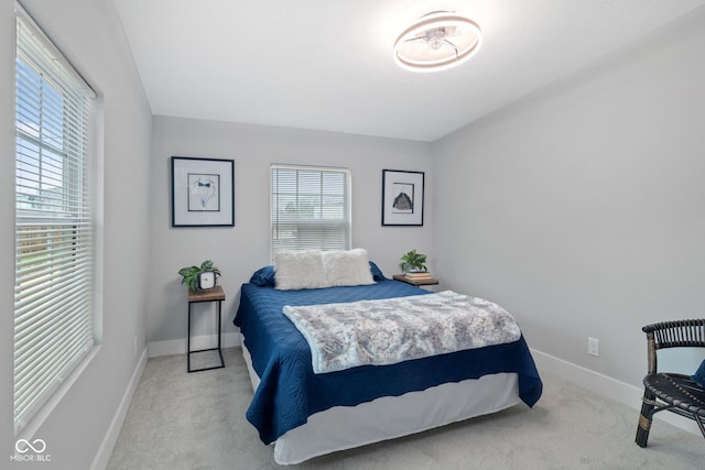 bedroom with carpet flooring and baseboards