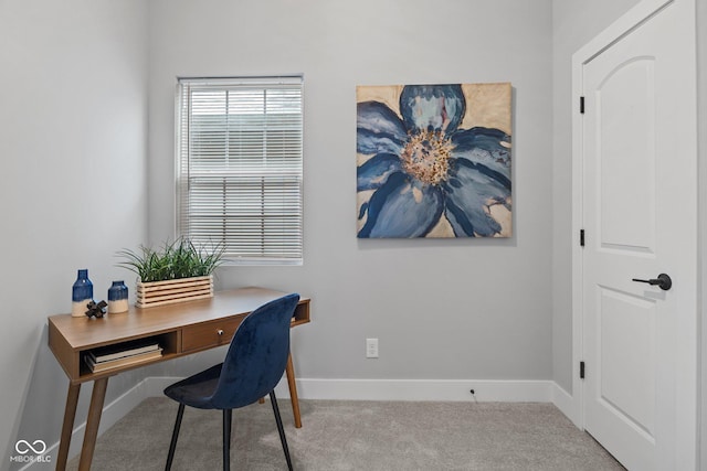 carpeted office with baseboards