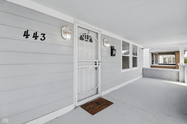 443 N Alton Ave, Indianapolis, IN 46222 - view of exterior entry featuring a porch