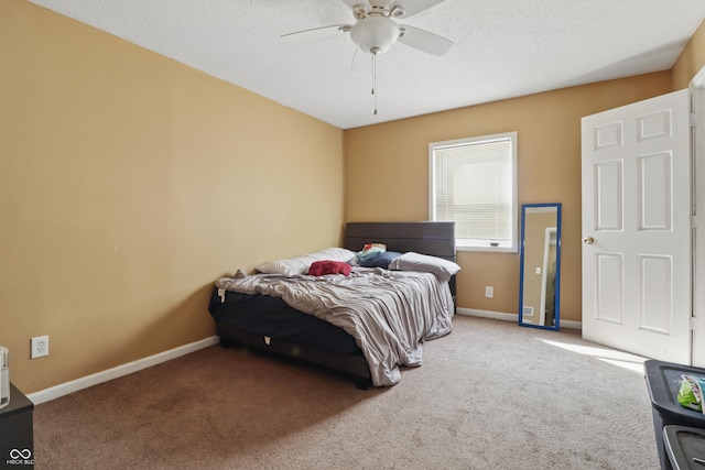 443 N Alton Ave, Indianapolis, IN 46222 - carpeted bedroom with baseboards, a ceiling fan, and a textured ceiling