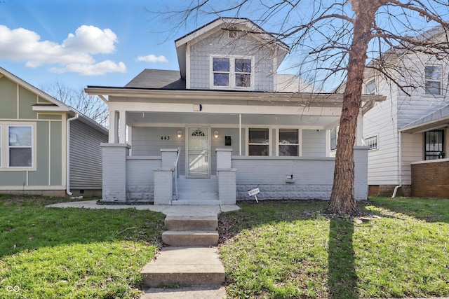443 N Alton Ave, Indianapolis, IN 46222 - view of front facade with covered porch and a front lawn
