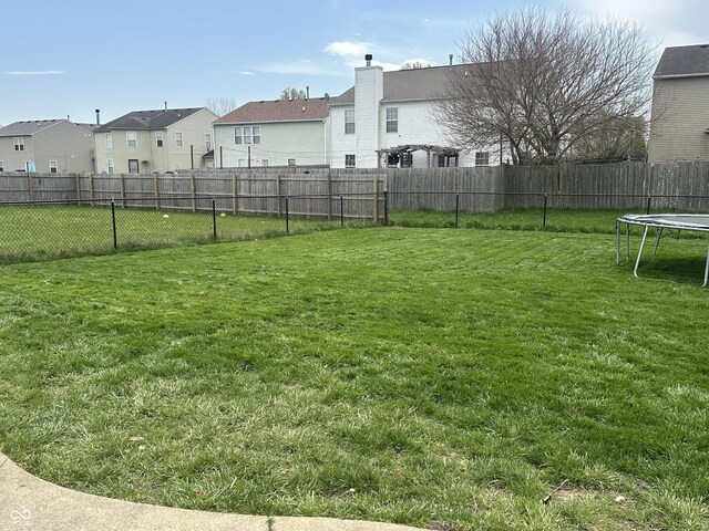 9873 Blue Ridge Way, Indianapolis, IN 46234 - view of yard with a trampoline and a residential view