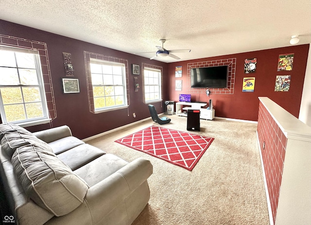 9873 Blue Ridge Way, Indianapolis, IN 46234 - carpeted living area featuring a ceiling fan, a textured ceiling, plenty of natural light, an accent wall, and baseboards