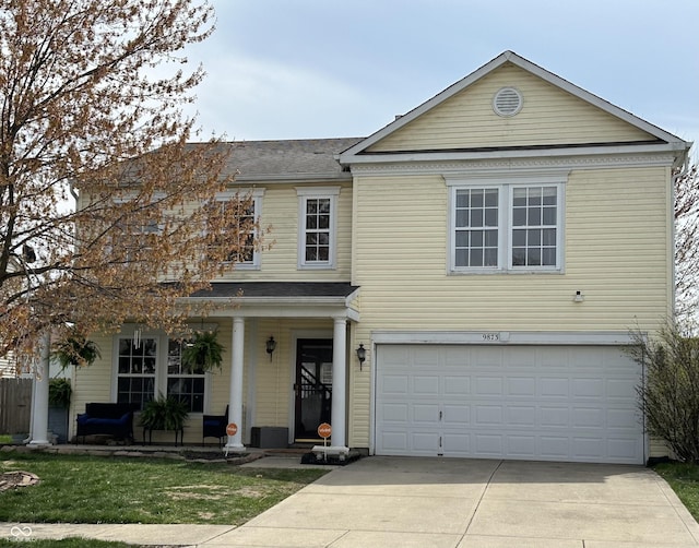 9873 Blue Ridge Way, Indianapolis, IN 46234 - traditional-style home featuring driveway, an attached garage, a porch, roof with shingles, and a front yard