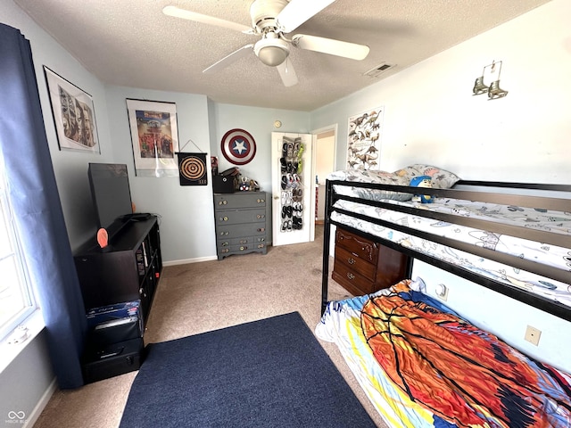 9873 Blue Ridge Way, Indianapolis, IN 46234 - bedroom with carpet, a textured ceiling, a ceiling fan, and baseboards
