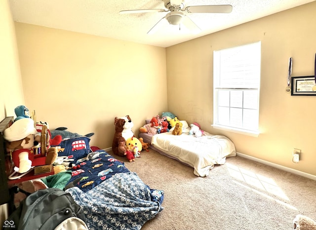 9873 Blue Ridge Way, Indianapolis, IN 46234 - carpeted bedroom with baseboards, ceiling fan, and a textured ceiling