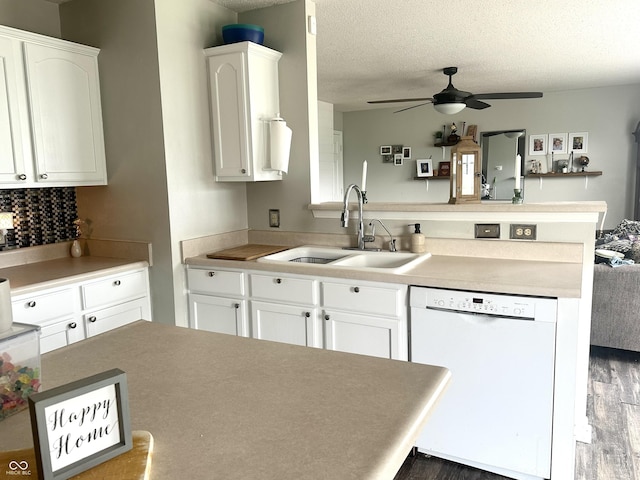 9873 Blue Ridge Way, Indianapolis, IN 46234 - kitchen featuring white dishwasher, a sink, a peninsula, ceiling fan, and wood finished floors