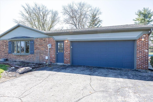 19702 Tomlinson Rd, Westfield, IN 46074 - single story home featuring aphalt driveway, brick siding, and an attached garage