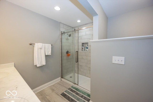 19702 Tomlinson Rd, Westfield, IN 46074 - full bathroom featuring recessed lighting, vanity, baseboards, and a stall shower