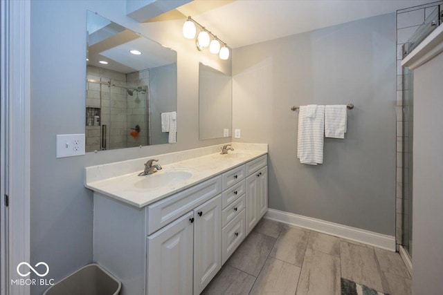 19702 Tomlinson Rd, Westfield, IN 46074 - full bathroom with tiled shower, double vanity, a sink, and baseboards