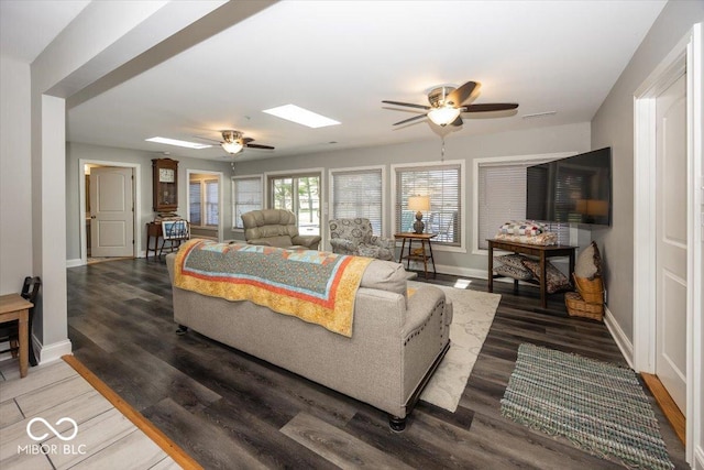 19702 Tomlinson Rd, Westfield, IN 46074 - living area with a skylight, wood finished floors, ceiling fan, and baseboards