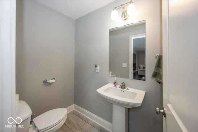 19702 Tomlinson Rd, Westfield, IN 46074 - bathroom with toilet, baseboards, and tile patterned flooring
