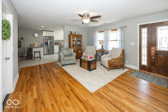 19702 Tomlinson Rd, Westfield, IN 46074 - living room with light wood-style flooring, ceiling fan, and baseboards