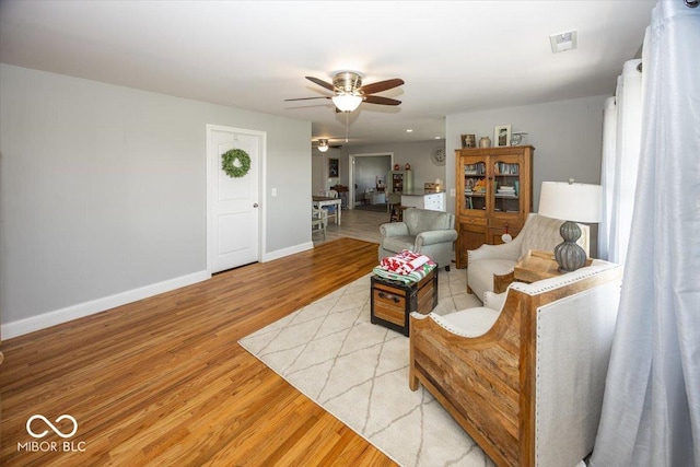 19702 Tomlinson Rd, Westfield, IN 46074 - living room with light wood-style floors, visible vents, baseboards, and ceiling fan
