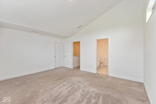 13423 E 134th St, Fishers, IN 46037 - unfurnished bedroom featuring carpet floors, high vaulted ceiling, connected bathroom, and a walk in closet