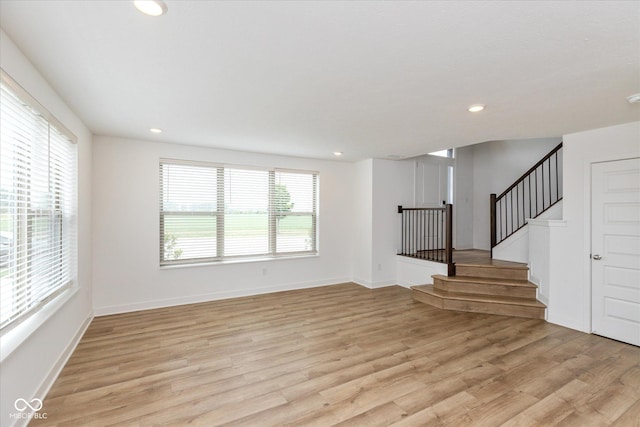 13423 E 134th St, Fishers, IN 46037 - unfurnished living room with light wood-style flooring, recessed lighting, and stairs