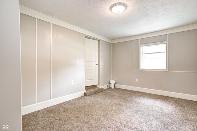 6189 Vigo Dr, Clayton, IN 46118 - unfurnished bedroom featuring a textured ceiling, carpet flooring, ornamental molding, and a closet