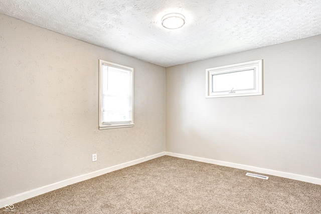 6189 Vigo Dr, Clayton, IN 46118 - empty room with carpet flooring and a textured ceiling