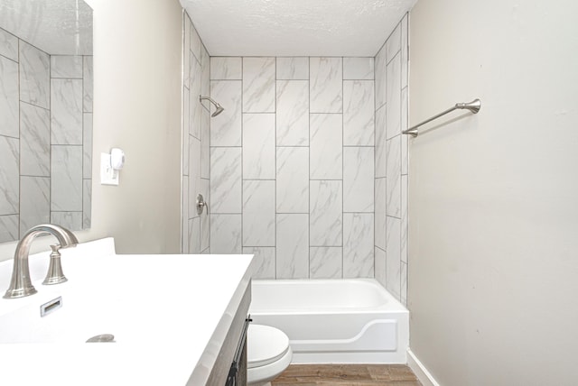 6189 Vigo Dr, Clayton, IN 46118 - bathroom featuring vanity, wood finished floors, a textured ceiling, and tub / shower combination