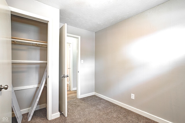 6189 Vigo Dr, Clayton, IN 46118 - unfurnished bedroom with carpet floors, a closet, and a textured ceiling