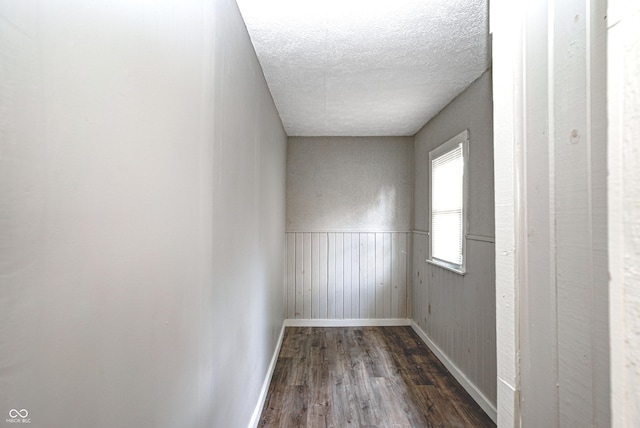 6189 Vigo Dr, Clayton, IN 46118 - empty room featuring wood finished floors, a textured ceiling, and a wainscoted wall