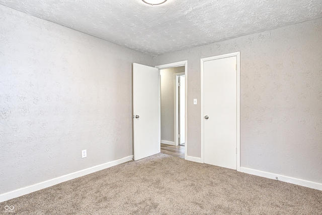 6189 Vigo Dr, Clayton, IN 46118 - carpeted spare room with a textured ceiling
