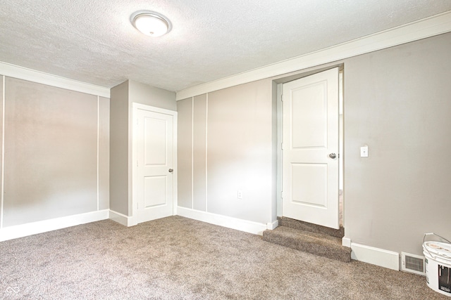 6189 Vigo Dr, Clayton, IN 46118 - below grade area featuring carpet and a textured ceiling