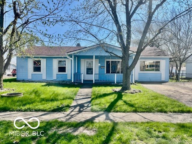 213 Harrell Dr, Edinburgh, IN 46124 - view of front of house featuring a porch and a front lawn