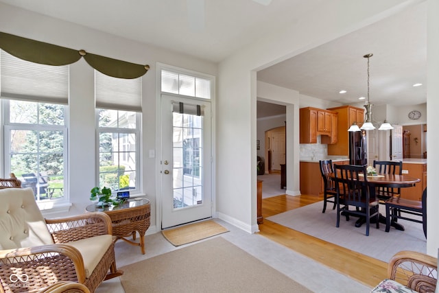 interior space with recessed lighting, baseboards, and light tile patterned flooring