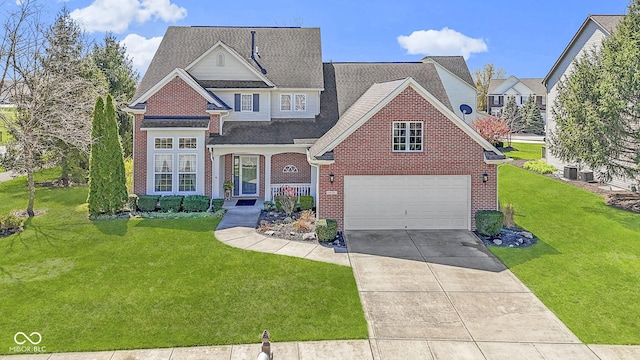 view of front of home with a shingled roof, driveway, brick siding, a front yard, and a garage