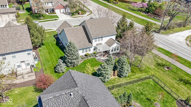 birds eye view of property with a residential view