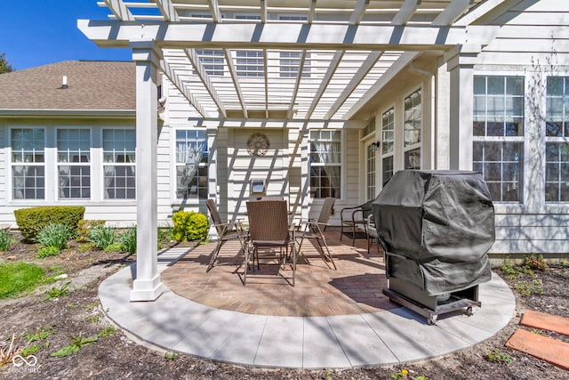 view of patio featuring a pergola, outdoor dining area, and a grill